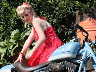 Cute Blonde Enjoys Posing Next To A Bike free video